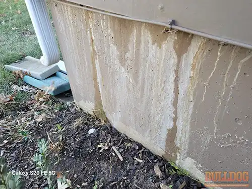 Active water running down foundation wall - Southdowns, Olathe, KS - December 2025 - 39-year-old split-level