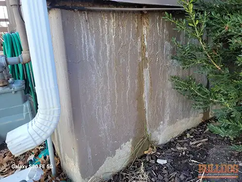 Heavy water stains on foundation - Southdowns, Olathe, KS - December 2025 - 39-year-old split-level home