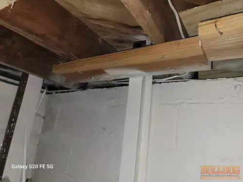 Wood bracket detail on I-beam repair - Marlborough Heights, Kansas City, MO - December 2025 - improper anchoring