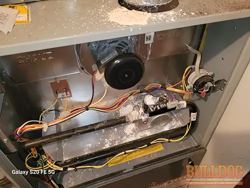 zinc-oxide-around-furnace-kansas-city-ks-6851-garfield-dr-66102-39.12537190N-94.73748000W-bulldog-home-inspections-20251204_150610 White zinc oxide powder around furnace exhaust vent - Cedarholm, Kansas City, KS - December 2025