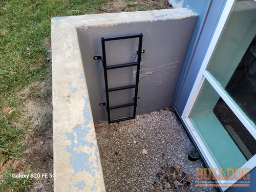 Egress window well ladder in Genesis Place at Green Hills of Kansas City, MO – 64154 (39.26752550N, 94.62590120W)