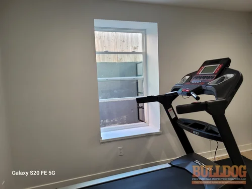 Egress window well with open window in Genesis Place at Green Hills, Kansas City, MO – 64154 (39.26752550N, 94.62590120W)