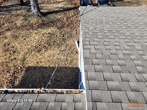 Service cables rubbing drip edge in Meadowmere subdivision of Grandview, MO 64030 (38.87638920N, 94.51675420W)