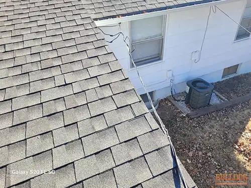 Service cables rubbing shingles in Meadowmere subdivision of Grandview, MO 64030 (38.87638920N, 94.51675420W)