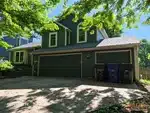 Exterior of 30-year-old split-level home in Prairie Park subdivision of Lawrence, KS — 66046