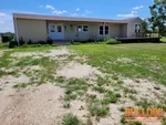 Home inspection of a 6-year-old manufactured ranch home in Henry County off NW Hwy K in Urich, MO (38.4042N, 93.9734W).