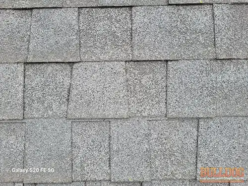 Close-up of worn asphalt shingles in Foxhaven subdivision of Raymore, MO – 64083 (38.81199980N, 94.48856710W)