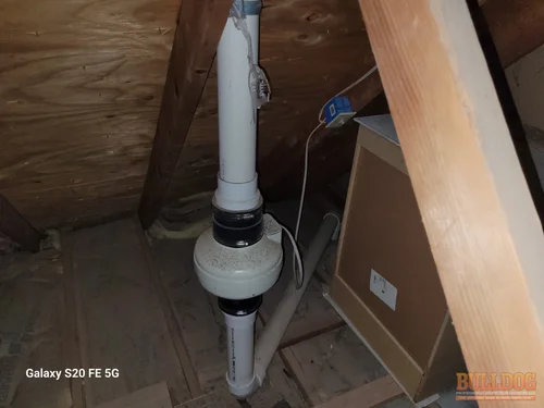 Radon mitigation system fan detail in Brougham Village subdivision of Olathe, KS — 66062 (38.85294200N, 94.77380650W)