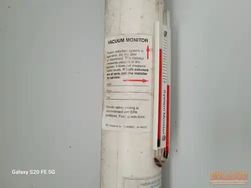 Radon system manometer in Brougham Village subdivision of Olathe, KS — 66062 (38.85294200N, 94.77380650W)