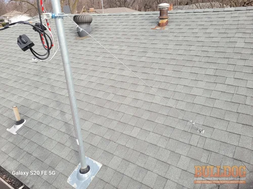 Guy wire system on service mast in Park Lane of Kansas City, MO – 64134 (38.94150380N, 94.51049700W)