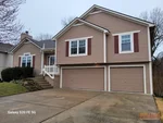 home-inspector-1321-se-princeton-dr-lees-summit-mo-64081-20260305_100530 Exterior of 26-year-old split-level home in Princeton Heights subdivision of Lee's Summit, MO — 64081
