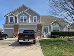 home-inspector-2707-sw-arthur-dr-lees-summit-mo-64082-20260313_140149 Exterior of 25-year-old split-level home in Monarch View subdivision of Lee's Summit, MO — 64082