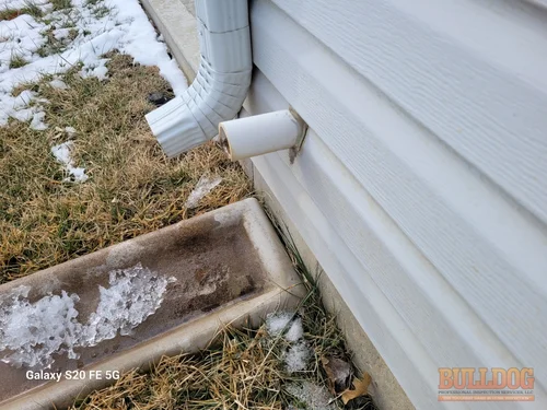 Image of sump pump drain line in Hazelwood Villas subdivision of Kansas City, KS 66109