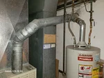 Alt Text:
Gas furnace and water heater venting into unlined clay chimney flue in Nall Hills subdivision of Overland Park, KS — 66212