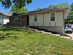 Exterior of 50-year-old ranch-style home in Woods Chapel Acres subdivision of Lee's Summit, MO — 64064