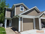 Exterior of 27-year-old 2-story townhome in Condos of Oaks Ridge Meadows subdivision of Lee's Summit, MO — 64064