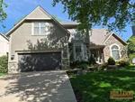 Exterior of 34-year-old 2-story home in Deer Creek subdivision of Overland Park, KS — 66213