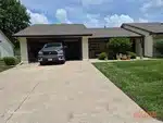 Exterior of 25-year-old ranch-style half duplex in Pickering Place subdivision of Belton, MO — 64012