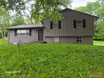 Exterior of 49-year-old raised ranch in Plateau Park subdivision of Kansas City, MO — 64151