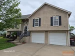 Exterior of 22-year-old split-level home in Brooke Haven subdivision of Kearney, MO — 64060