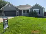 Exterior of 24-year-old ranch-style home in Newberry subdivision of Lee's Summit, MO — 64081