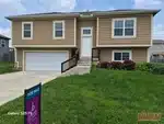 Exterior of 9-year-old split-level home in Whitetail subdivision of Olathe, KS — 66061