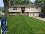 Exterior of 53-year-old split-level home in Rolling Ridge South subdivision of Olathe, KS — 66061