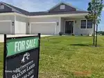 Exterior of new-construction reverse ranch half-duplex in The Highlands at Falcon Lakes subdivision of Basehor, KS — 66007
