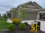 Exterior of new-construction ranch-style villa in Covington Court subdivision of Olathe, KS — 66061