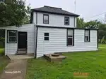 Exterior of 126-year-old 2-story home in Paola, KS — 66071