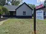 Exterior of 98-year-old ranch-style home in Sanders Addition subdivision of Creighton, MO — 64739