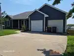 Exterior of 22-year-old ranch-style home in Madison Park subdivision of Excelsior Springs, MO — 64024
