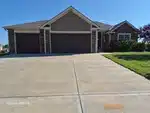 Exterior of 10-year-old reverse 1.5-story home in Rock Creek subdivision of Smithville, MO — 64089